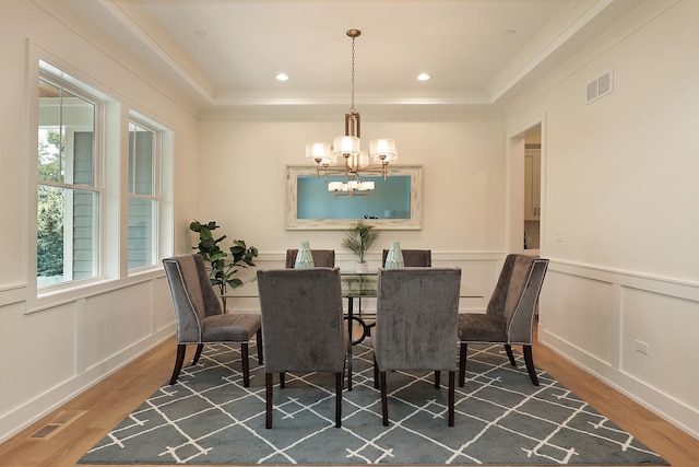 1947 Summerton Pl, Northbrook, IL 60062 - dining room featuring a chandelier, wood finished floors, crown molding, a wainscoted wall, and a raised ceiling