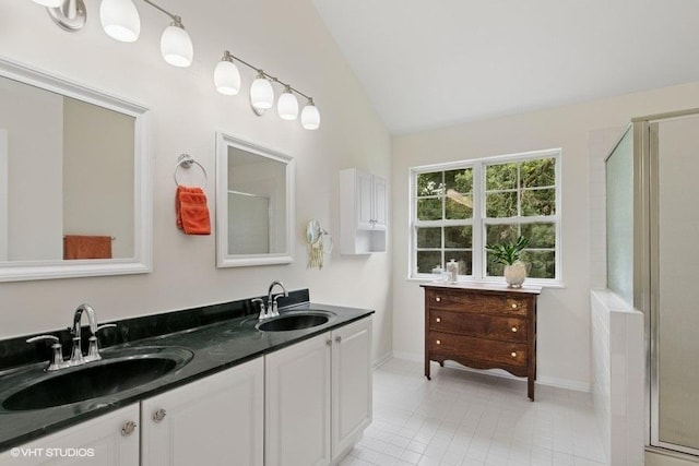 36917 N Deer Trail Dr, Lake Villa, IL 60046 - full bath with lofted ceiling, a shower with shower door, double vanity, and tile patterned floors
