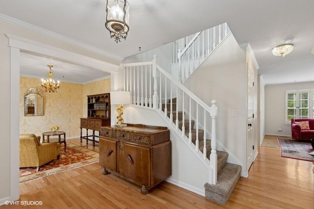 36917 N Deer Trail Dr, Lake Villa, IL 60046 - staircase with a chandelier, wood finished floors, and crown molding