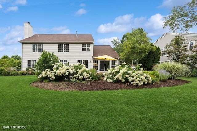 36917 N Deer Trail Dr, Lake Villa, IL 60046 - rear view of property with a yard and a chimney