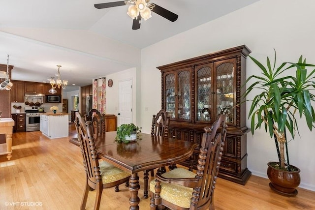 36917 N Deer Trail Dr, Lake Villa, IL 60046 - dining area featuring light wood-type flooring, a ceiling fan, a chandelier, and lofted ceiling