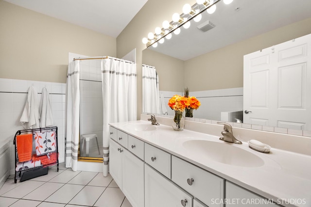 1500 S Ardmore Ave Unit 612, Villa Park, IL 60181 - bathroom featuring a tile shower, double vanity, and tile patterned flooring
