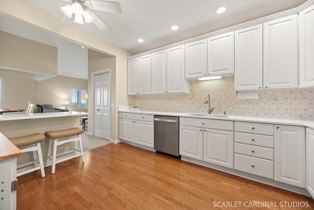 1500 S Ardmore Ave Unit 612, Villa Park, IL 60181 - kitchen featuring stainless steel dishwasher, white cabinetry, a ceiling fan, light countertops, and light wood-style floors