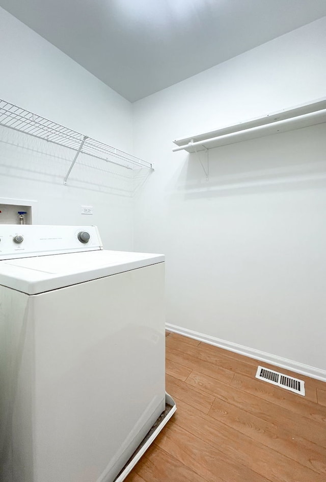 635 Conservatory Ln Unit 635, Aurora, IL 60502 - laundry area with washer / dryer and light wood-type flooring