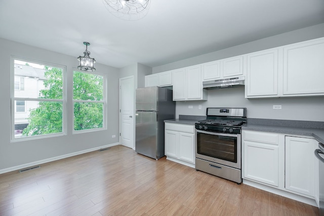 635 Conservatory Ln Unit 635, Aurora, IL 60502 - kitchen with stainless steel appliances, under cabinet range hood, and white cabinetry