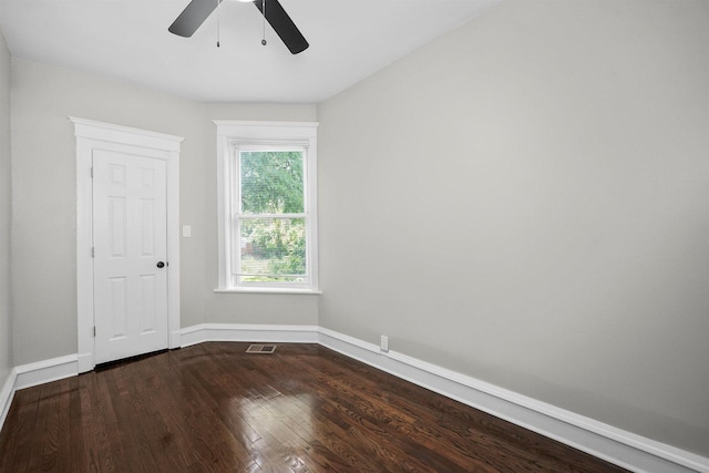 7548 S Harvard Ave, Chicago, IL 60620 - empty room with a ceiling fan and dark wood-style flooring