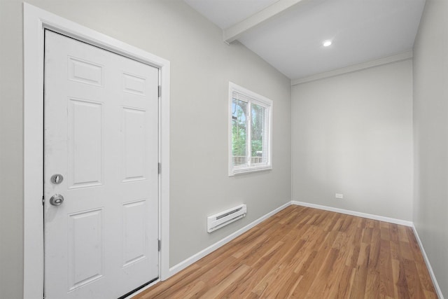 7548 S Harvard Ave, Chicago, IL 60620 - empty room featuring light wood-type flooring, beam ceiling, and a baseboard radiator