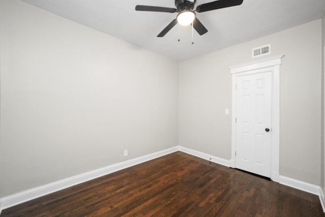 7548 S Harvard Ave, Chicago, IL 60620 - empty room with dark wood finished floors and a ceiling fan