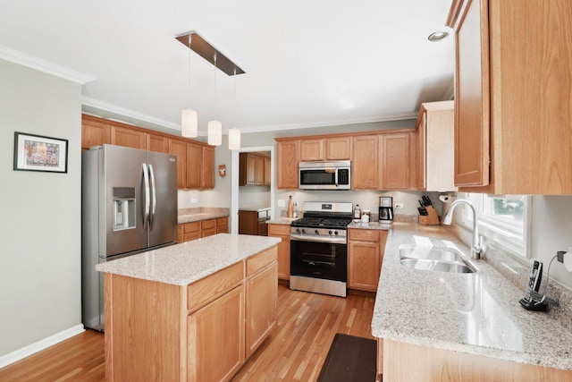 305 Buckingham Dr, Algonquin, IL 60102 - kitchen with appliances with stainless steel finishes, crown molding, a kitchen island, light wood-type flooring, and light stone counters