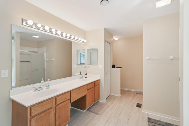 305 Buckingham Dr, Algonquin, IL 60102 - full bathroom featuring double vanity, a shower with door, and wood finished floors