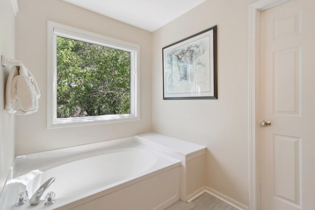 305 Buckingham Dr, Algonquin, IL 60102 - bathroom with a bath and baseboards