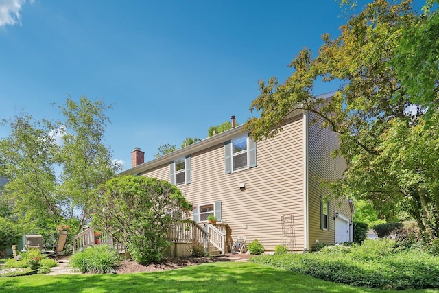 305 Buckingham Dr, Algonquin, IL 60102 - view of side of property with a chimney, a deck, and a lawn