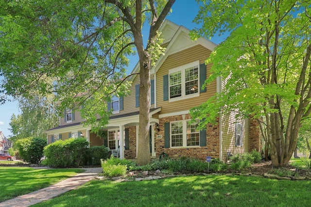 305 Buckingham Dr, Algonquin, IL 60102 - traditional-style house featuring brick siding and a front lawn