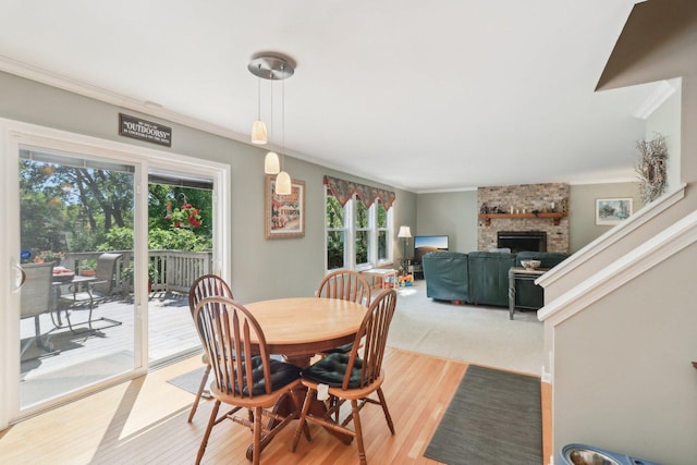 305 Buckingham Dr, Algonquin, IL 60102 - dining space featuring ornamental molding, a fireplace, and light wood finished floors