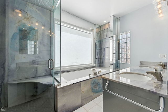 4736 N Lincoln Ave Unit 4, Chicago, IL 60625 - bathroom with double vanity, a bath, a marble finish shower, and tile patterned flooring