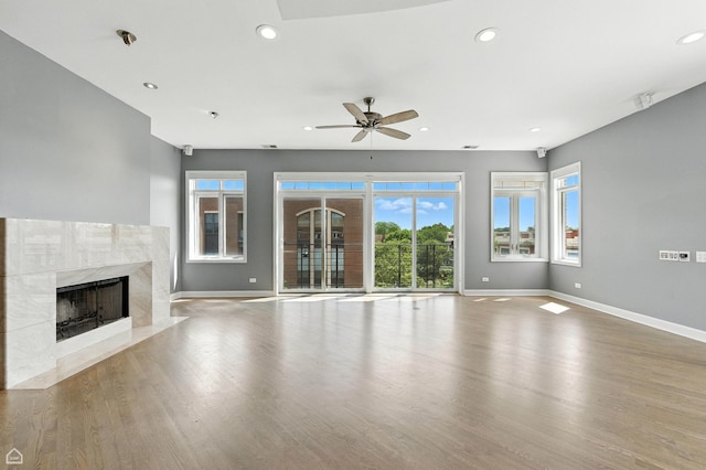 4736 N Lincoln Ave Unit 4, Chicago, IL 60625 - unfurnished living room featuring a fireplace, a ceiling fan, recessed lighting, healthy amount of natural light, and wood finished floors