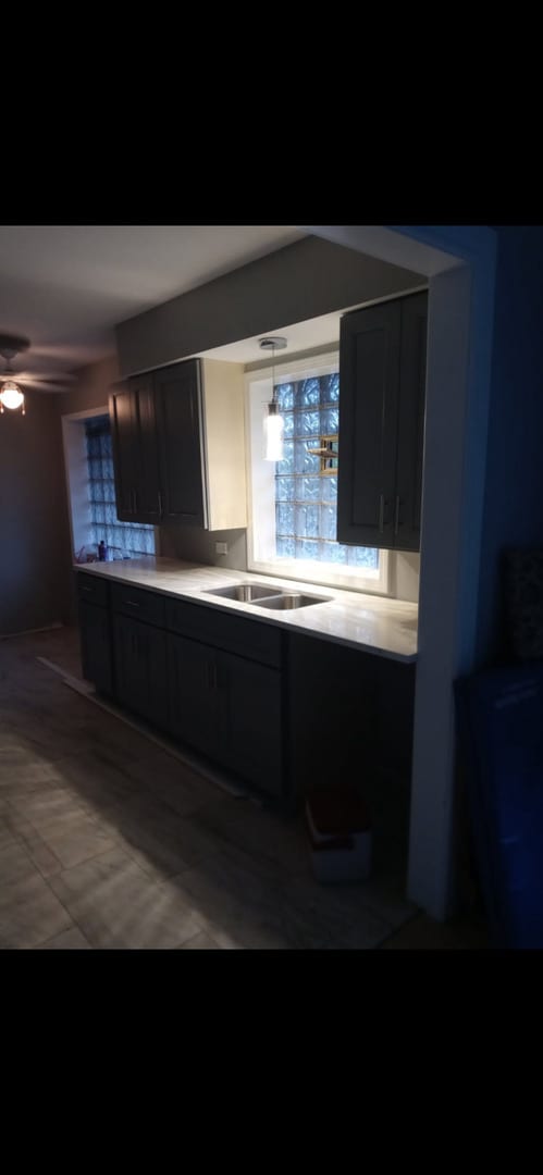 16265 Drexel Ave, South Holland, IL 60473 - kitchen with light countertops and ceiling fan
