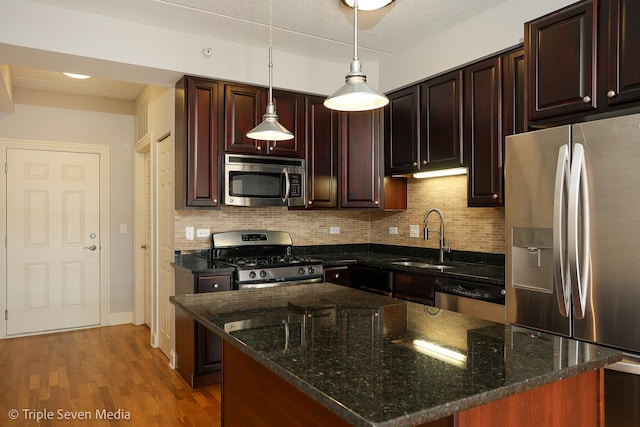 1670 Mill St Unit 508, Des Plaines, IL 60016 - kitchen featuring appliances with stainless steel finishes, decorative backsplash, and dark stone countertops