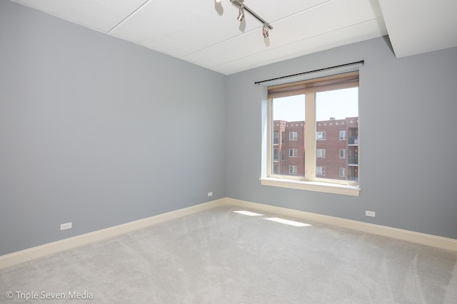 1670 Mill St Unit 508, Des Plaines, IL 60016 - empty room featuring carpet and rail lighting