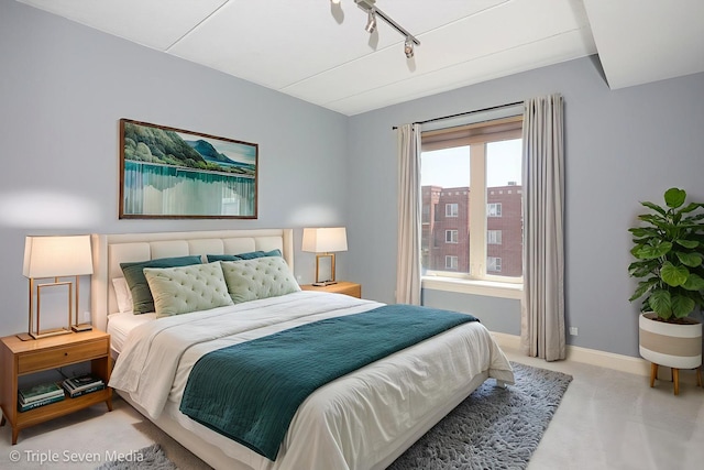 1670 Mill St Unit 508, Des Plaines, IL 60016 - carpeted bedroom with baseboards and rail lighting