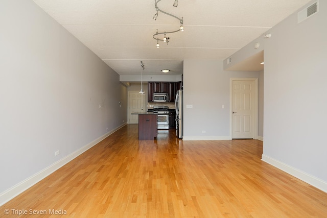 1670 Mill St Unit 508, Des Plaines, IL 60016 - unfurnished living room with light wood-type flooring and track lighting