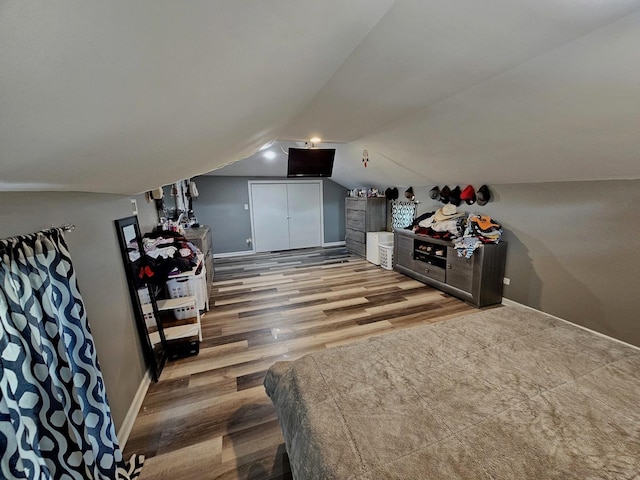 121 N Governor St, Sycamore, IL 60178 - bedroom with lofted ceiling, wood finished floors, and washer / clothes dryer