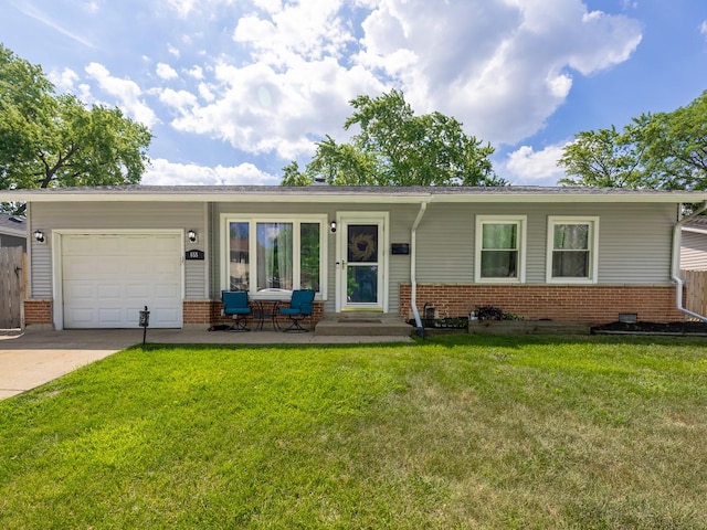 655 Charing Cross Rd, Elk Grove Village, IL 60007 - ranch-style house with brick siding, an attached garage, driveway, and a front lawn