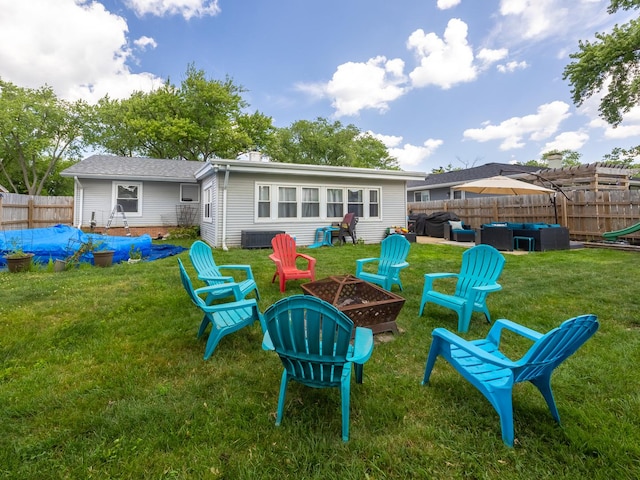 655 Charing Cross Rd, Elk Grove Village, IL 60007 - back of house featuring an outdoor living space with a fire pit, a fenced backyard, and a shingled roof
