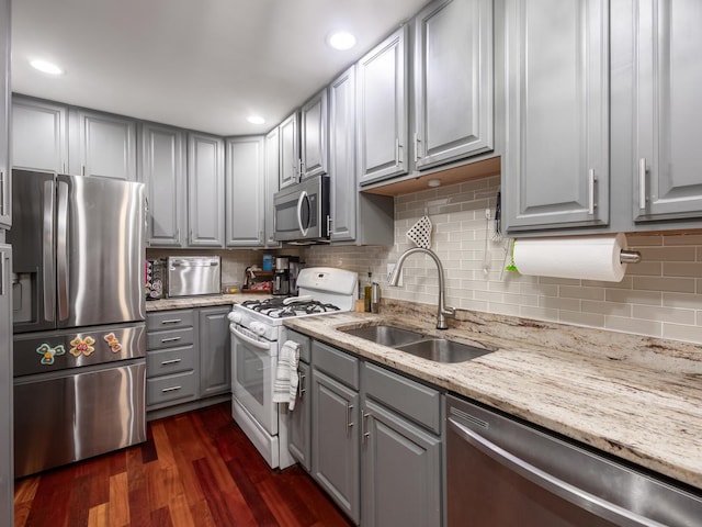 655 Charing Cross Rd, Elk Grove Village, IL 60007 - kitchen featuring stainless steel appliances, gray cabinetry, tasteful backsplash, dark wood finished floors, and light stone counters