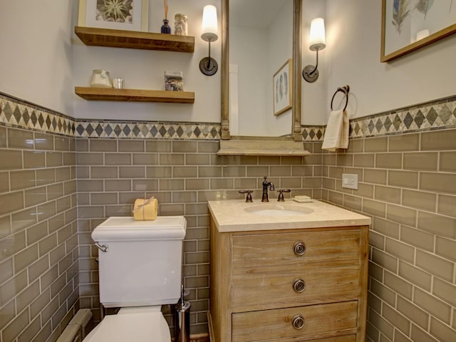 415 N Taylor Ave, Oak Park, IL 60302 - half bathroom with tile walls, vanity, and wainscoting