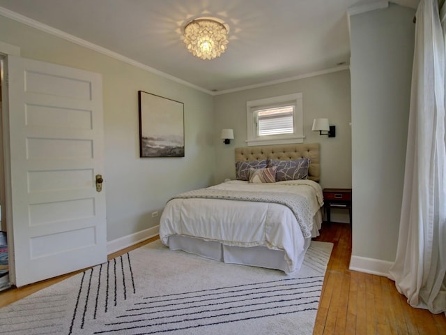 415 N Taylor Ave, Oak Park, IL 60302 - bedroom featuring crown molding and light wood finished floors