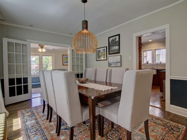 415 N Taylor Ave, Oak Park, IL 60302 - dining area featuring dark wood-style floors, healthy amount of natural light, and crown molding
