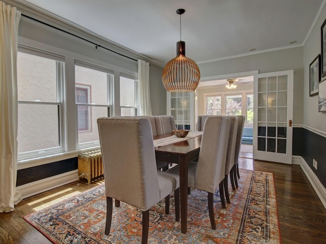 415 N Taylor Ave, Oak Park, IL 60302 - dining room with crown molding, plenty of natural light, wood-type flooring, and radiator heating unit