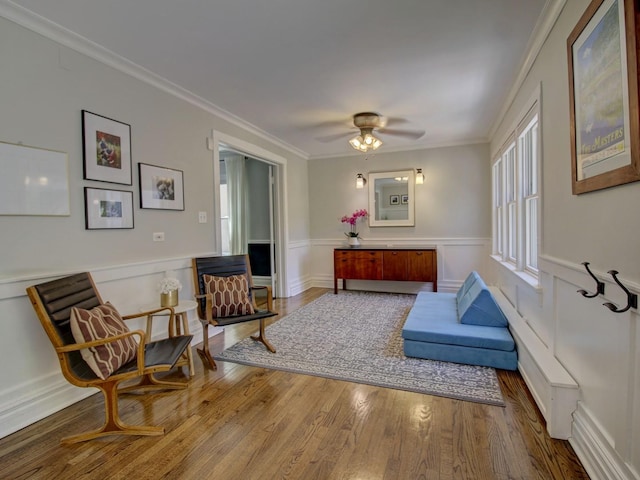 415 N Taylor Ave, Oak Park, IL 60302 - sitting room featuring wood finished floors, a wainscoted wall, crown molding, and a ceiling fan