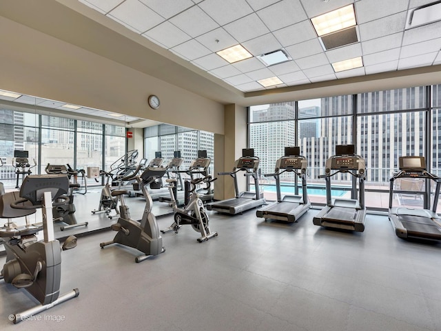 240 E Illinois St Unit 1002, Chicago, IL 60611 - workout area featuring a paneled ceiling, healthy amount of natural light, and a wall of windows