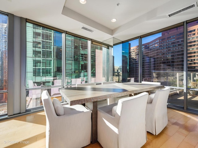 240 E Illinois St Unit 1002, Chicago, IL 60611 - dining area with expansive windows, a view of city, recessed lighting, and a tray ceiling