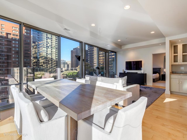 240 E Illinois St Unit 1002, Chicago, IL 60611 - dining space with light wood-style floors, expansive windows, and recessed lighting