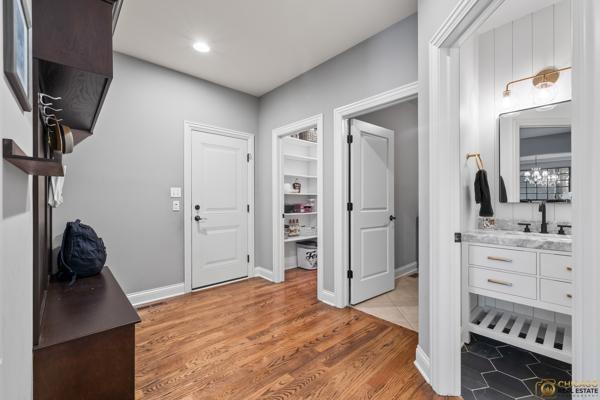 13119 Kinsale Ct, Lemont, IL 60439 - foyer featuring light wood-type flooring and baseboards