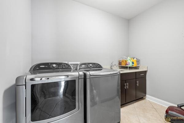 13119 Kinsale Ct, Lemont, IL 60439 - laundry room with washer and dryer, cabinet space, and light tile patterned floors