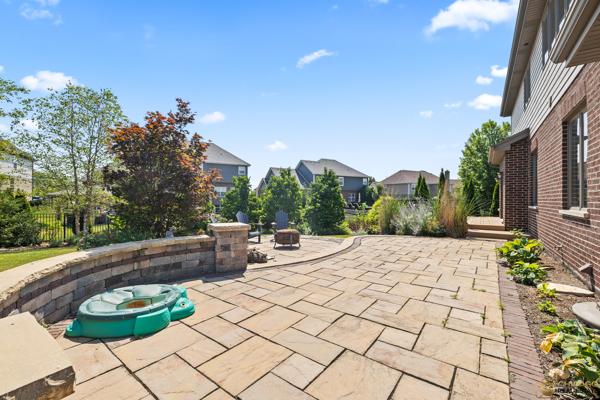 13119 Kinsale Ct, Lemont, IL 60439 - view of patio featuring a fire pit and a residential view