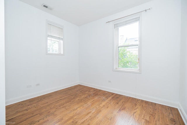 4536 N Sheridan Rd Unit 104, Chicago, IL 60640 - spare room featuring plenty of natural light and light wood-style floors