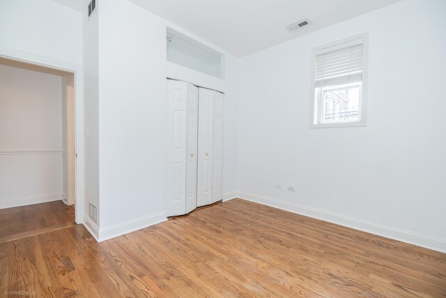4536 N Sheridan Rd Unit 104, Chicago, IL 60640 - unfurnished bedroom with light wood-type flooring and a closet