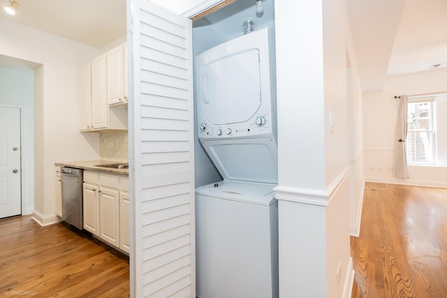 4536 N Sheridan Rd Unit 104, Chicago, IL 60640 - washroom with stacked washer / drying machine and light wood-style flooring