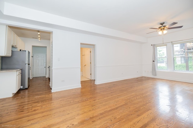 4536 N Sheridan Rd Unit 104, Chicago, IL 60640 - unfurnished living room featuring ceiling fan and light wood finished floors