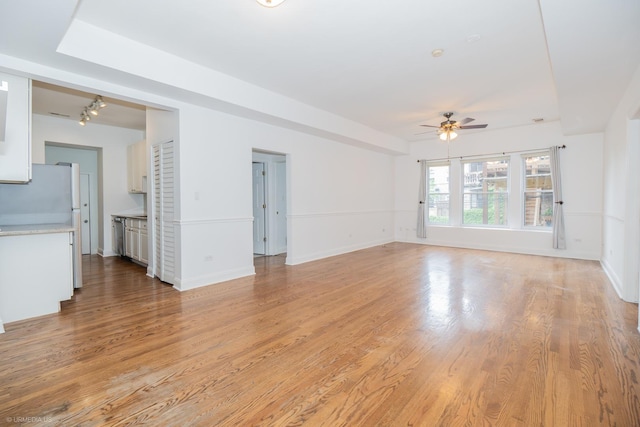 4536 N Sheridan Rd Unit 104, Chicago, IL 60640 - unfurnished living room with a ceiling fan and light wood-type flooring