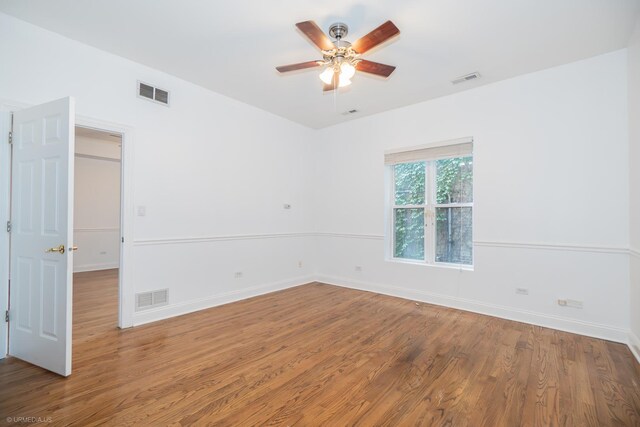 4536 N Sheridan Rd Unit 104, Chicago, IL 60640 - empty room featuring wood finished floors and ceiling fan