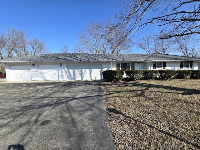 830 Crestview Dr, Decatur, IL 62549 - ranch-style home featuring asphalt driveway and a garage