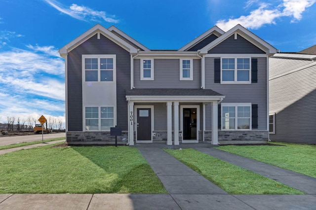 4944 Yates Dr Unit 0074, Mount Pleasant, WI 53403 - view of front of property with a front lawn, stone siding, and a porch