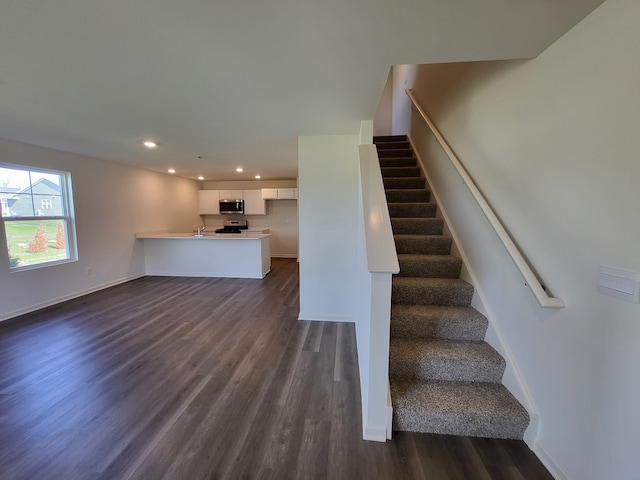 4944 Yates Dr Unit 0074, Mount Pleasant, WI 53403 - stairs with wood finished floors and recessed lighting