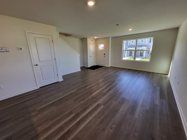 4944 Yates Dr Unit 0074, Mount Pleasant, WI 53403 - unfurnished living room with dark wood-style floors and recessed lighting